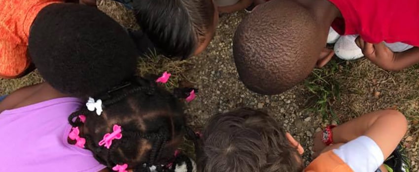 Kids looking at the ground